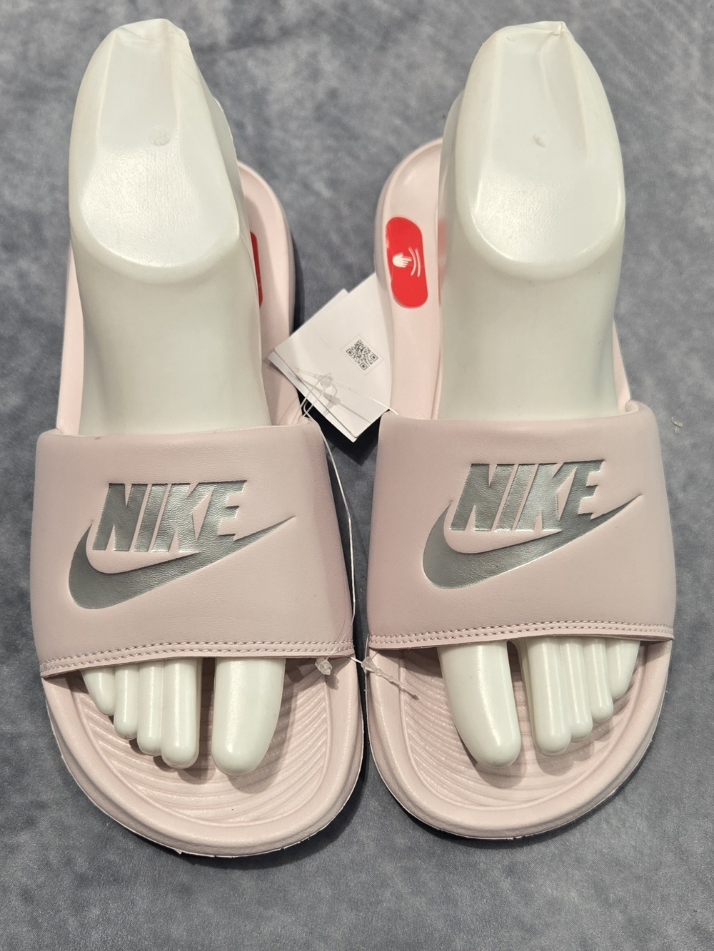 Nike Women’s Light Pink Slide Sandals with Silver Logo